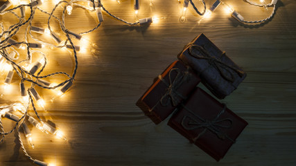 New Year's gifts on the background of festive bright lights concept of the New Year holiday