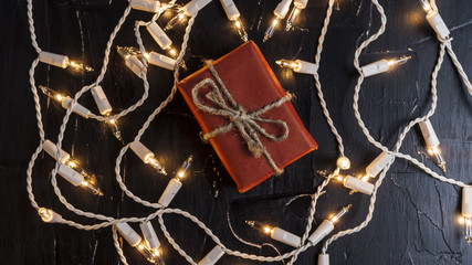 New Year's gifts on the background of festive bright lights concept of the New Year holiday