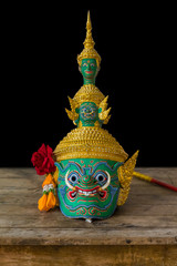 The mask of Thotsakan or Ravana, one of the demon king in Thai Ramayana pantomime on the wooden...