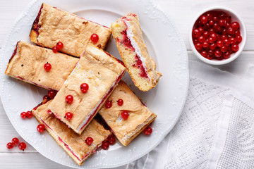 Red currant fruit pie bars with meringue on top. Top view.