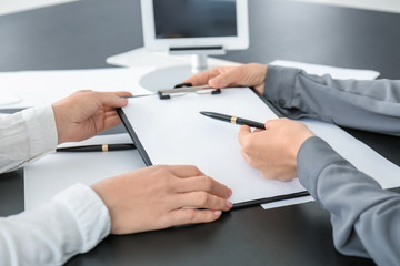 Office employees working with documents at desk