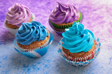 Tasty cupcakes on color background