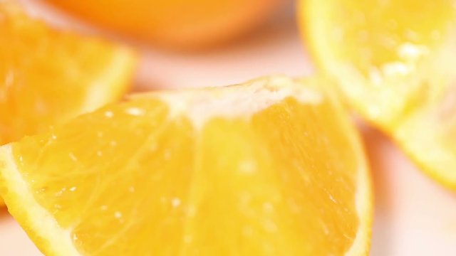 Close up of fresh orange slice on white table. 