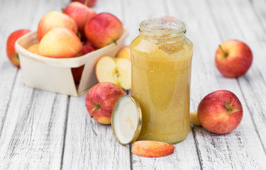 Old wooden table with fresh made Applesauce