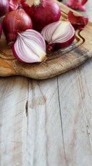 Red onions on a wooden board