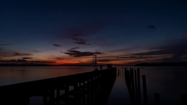 old small jetty in to the sea in sunrise or sunset evening time