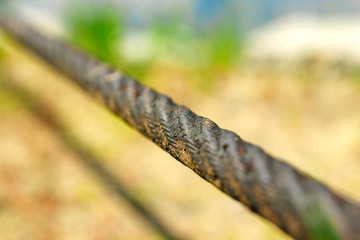 Steel wire rope close-up and shallow depth of field against the background of nature