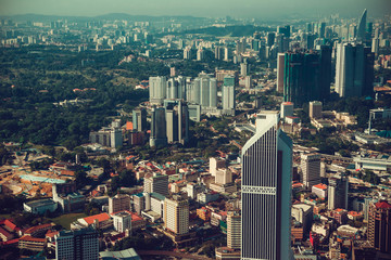 Fototapeta premium Modern architecture, business office building, cityscape background. Travel to Malaysia. Urban skyscrapers. Modern city. Financial district. Aerial view downtown. City tour. Kuala Lumpur public park.
