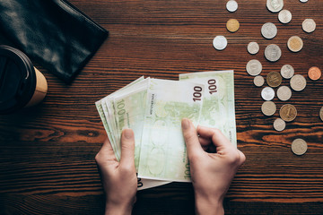 hands with banknotes and coins
