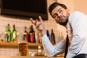 businessman with beer in bar