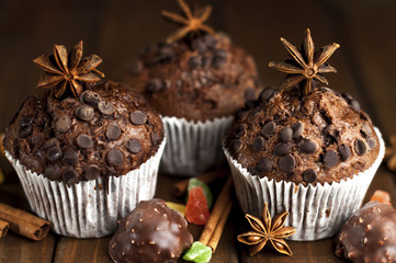 Chocolate cupcakes with filling, sweets on the table
