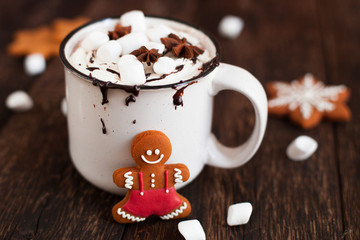 Mug of hot chocolate or cocoa with Christmas cookies and marsmallow