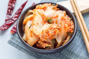 Kimchi cabbage. Korean appetizer in ceramic bowl, horizontal