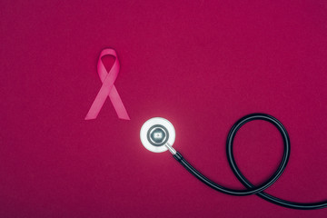 stethoscope and breast cancer ribbon