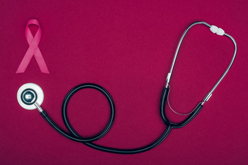 stethoscope and breast cancer ribbon