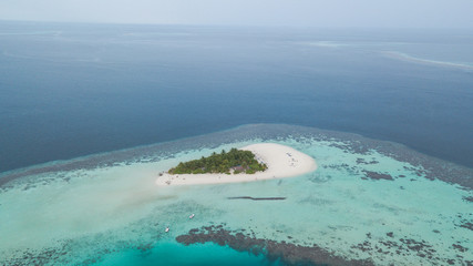 Fototapeta na wymiar desert island with a drone