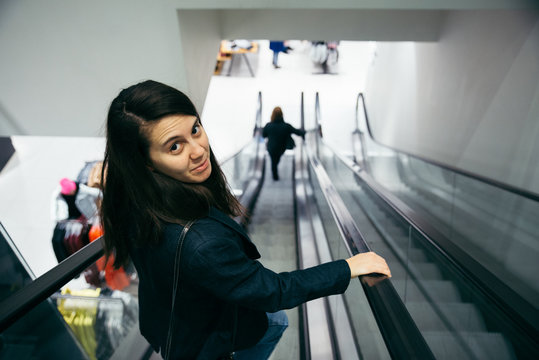 woman at escalator in the mall