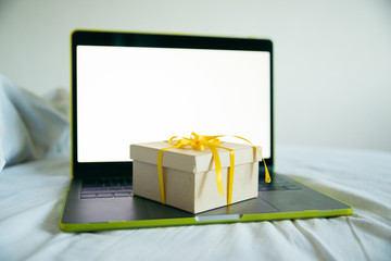 gift box with laptop on background