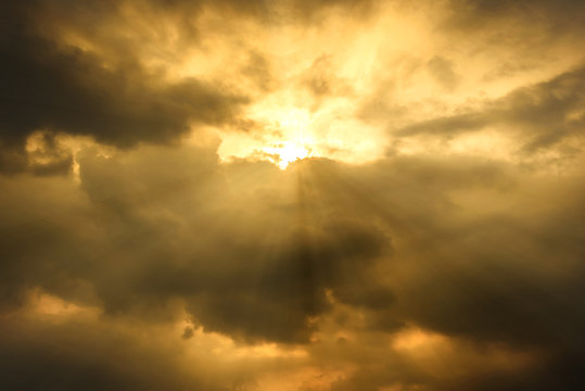 sun rays through cloudy sky, hope or opportunity concept