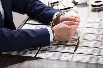 Businessperson In Handcuffs Arrested For Bribe