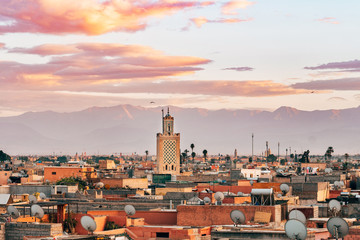 panoramic views of marrakech medina with atlas mountain range at background, morocco - obrazy, fototapety, plakaty