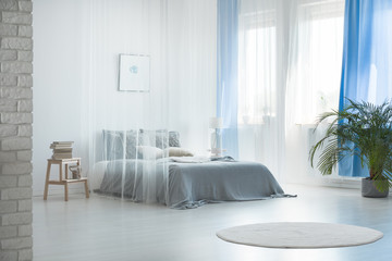 Romantic design of spacious bedroom