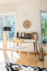 Wooden desk against white wall