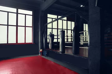 Fotobehang Punching bags for training in gym © Africa Studio