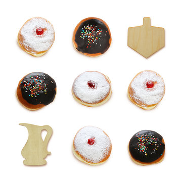 jewish holiday Hanukkah image with traditional doughnuts and spinning to isolated on white.