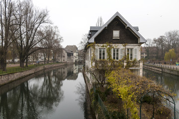 Fototapeta na wymiar Strasbourg, France - old european town cityscape - canals, embanlment, houses. December.