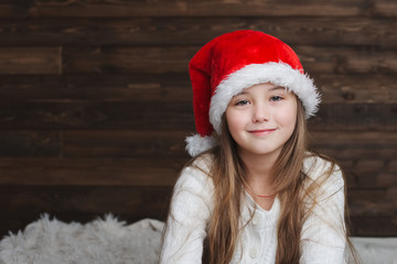 little happy girl with santa hat
