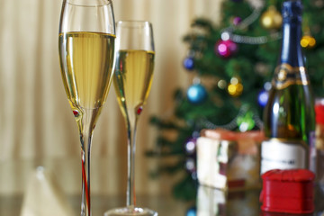 wineglass, bottle of champagne, Christmas tree and gifts