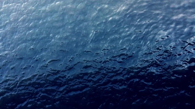 dark blue sea with soft waves 4K background