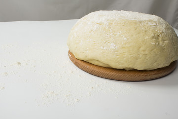Fototapeta na wymiar dough with close-up. man is preparing bread dough