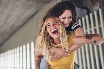 Best friends laughing and having a fun night out together