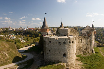 Fototapeta na wymiar Summer view to castle in Kamianets-Podilskyi