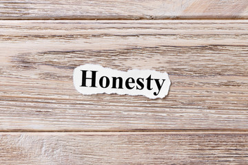 Honesty of the word on paper. concept. Words of Honesty on a wooden background