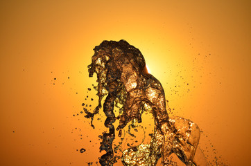Water splash isolated on sunset colors background.