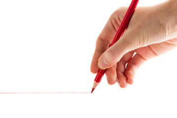 hand with the red pencil on a white background