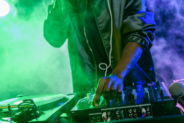 DJ with sound mixer on concert