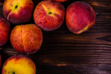 Fresh ripe peaches on wooden table. Top view