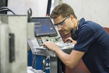 Machinist working in factory