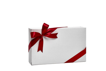 The white box wrapped with red ribbon with a bow