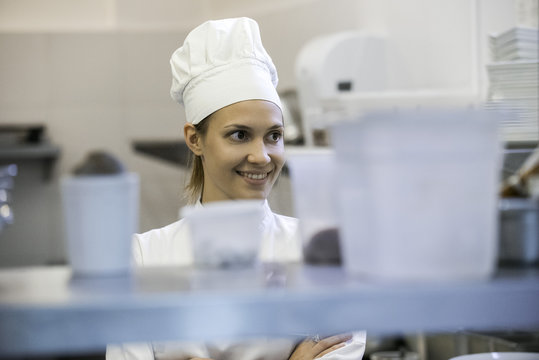 Young female chef in commercial kitchen