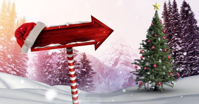 Wooden signpost in Christmas Winter landscape and Santa hat with
