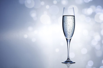 Silver sealed champagne on a background with space for advertising text 