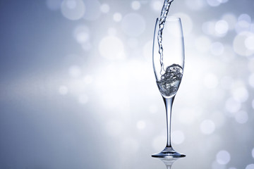 Silver sealed champagne on a background with space for advertising text 