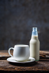 Bottles of milk and glass of milk