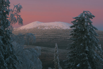 Snow-covered mountain peak in the early morning. National park 