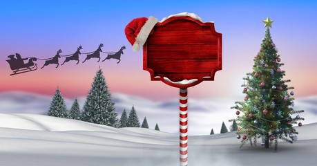 Wooden signpost in Christmas Winter landscape with Christmas